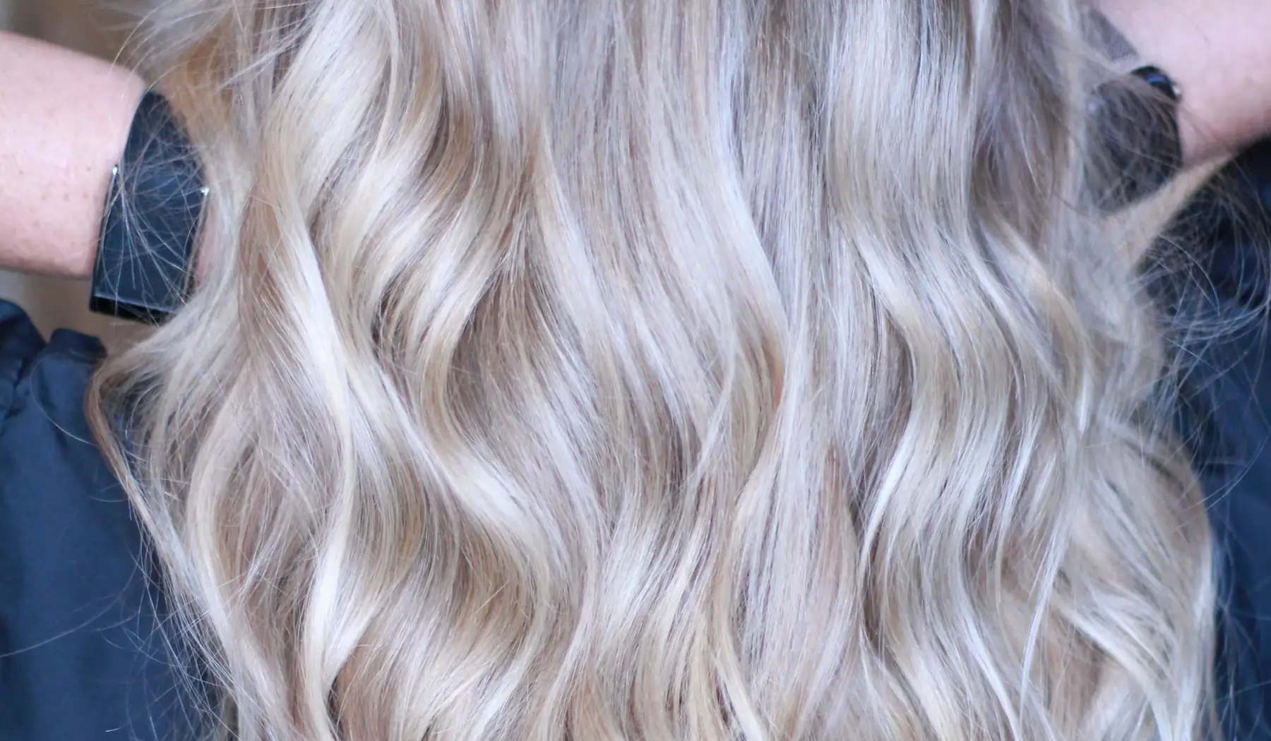 Full, long icy blonde waves after NBR extensions