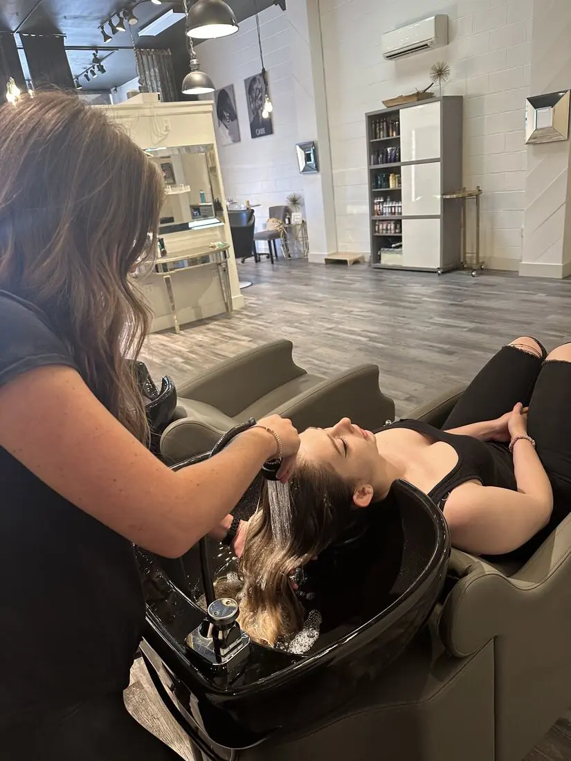 A guest at the shampoo bowl in the salon