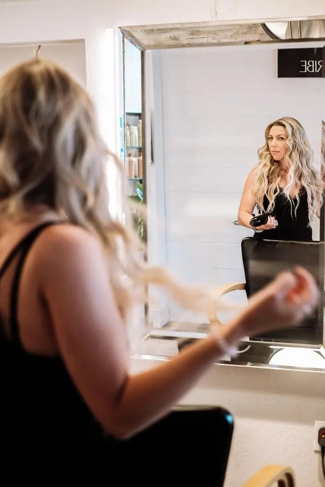 A guest seeing her color in the mirror